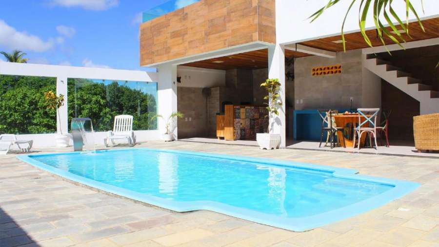 Casa com piscina privativa e poucos passos do mar em Cotovelo por Carpediem