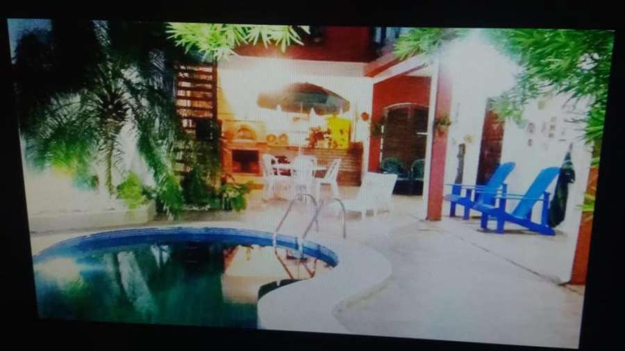 Foto do casa charme com piscina